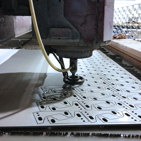 KMT Waterjet cutting nesting metal parts